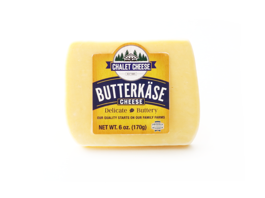 Butterkäse cheese block with Chalet Cheese label on a white background