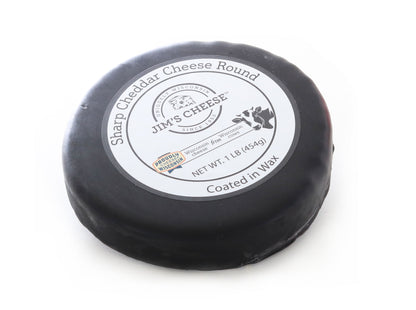 black wax wheel of sharp wisconsin cheddar cheese