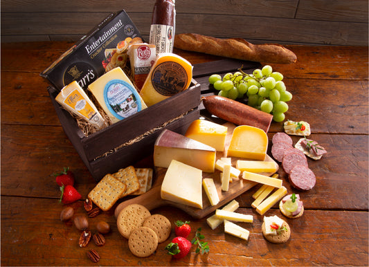 Gift basket with 4 varieties of cheese, sausage, and crackers