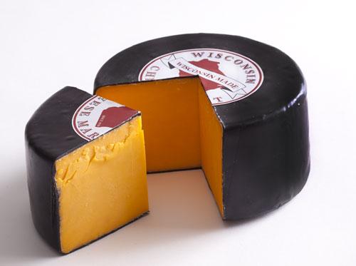 5 pound wheel of sharp cheddar cheese in black wax